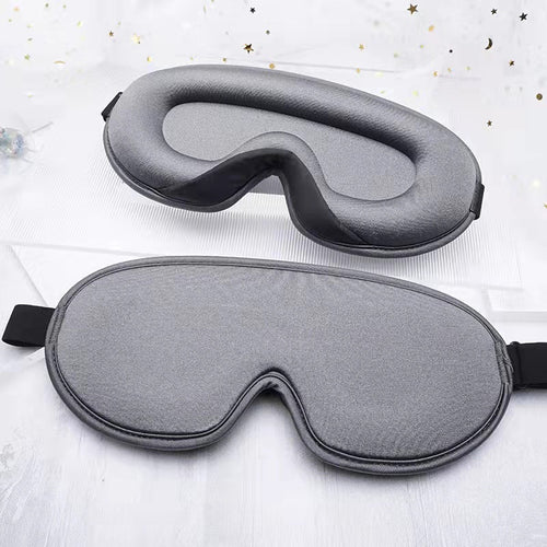 Somnia 3D contour sleep mask in gray - front and dome view showing zero eye pressure design