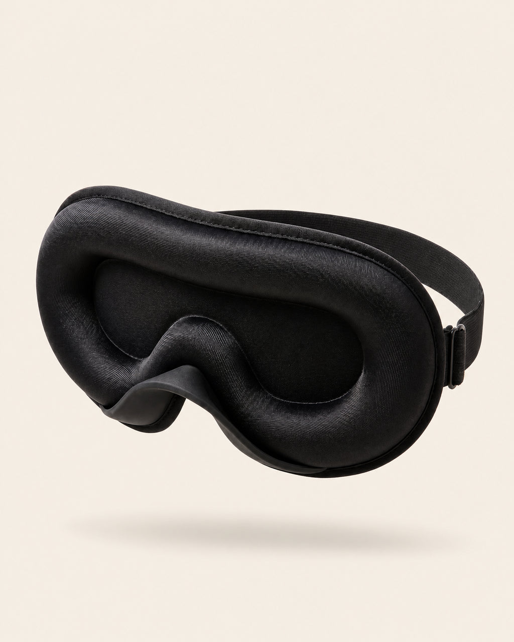 Somnia Sable 3D contour sleep mask, three-quarter view showing the ergonomic design