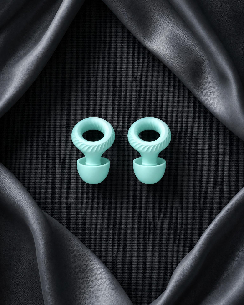 Somnia Mute sound-isolating earplugs in mint green